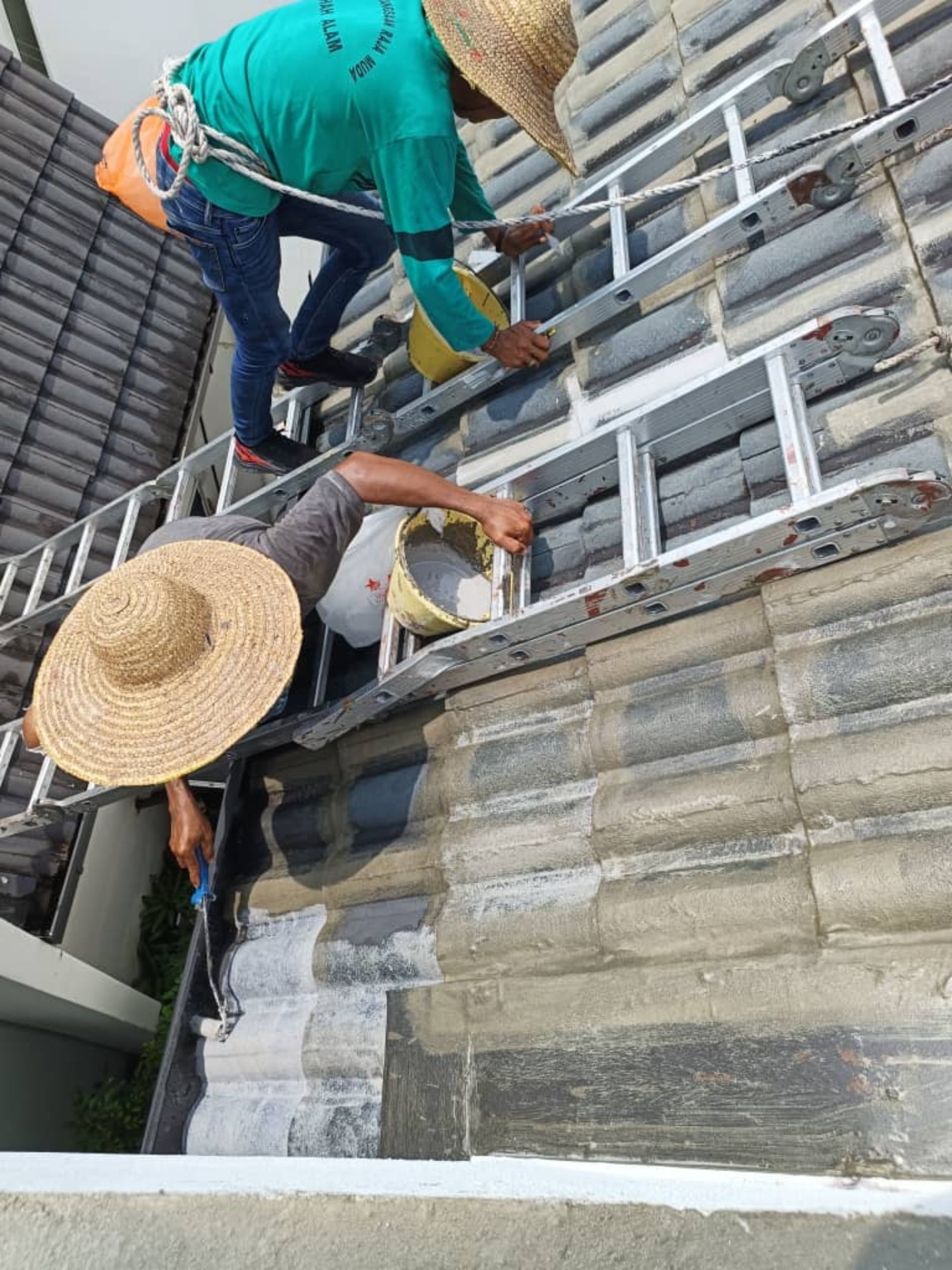 Close-up waterproofing treatment on tiled roof