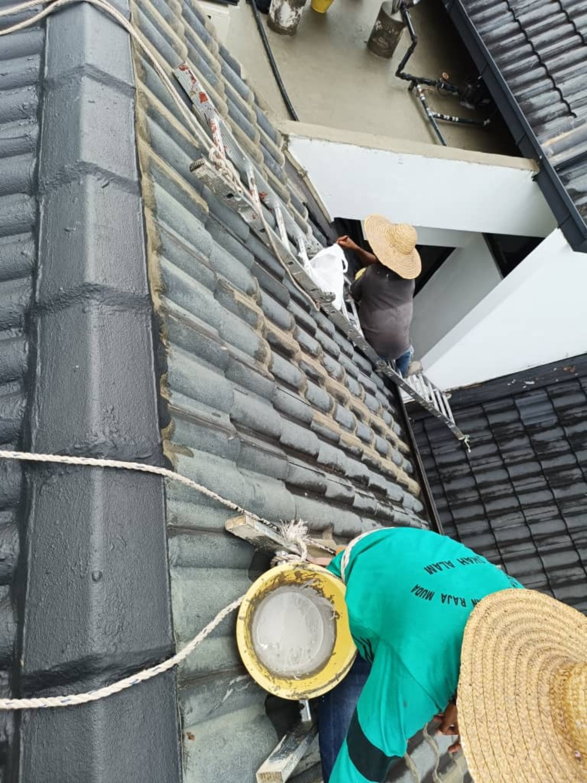 Roof tile waterproofing repair in progress
